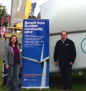 Leila Sharland of Sharenergy and Sheridan Jenkins of RM promoting Heartland in front of a WTN turbine